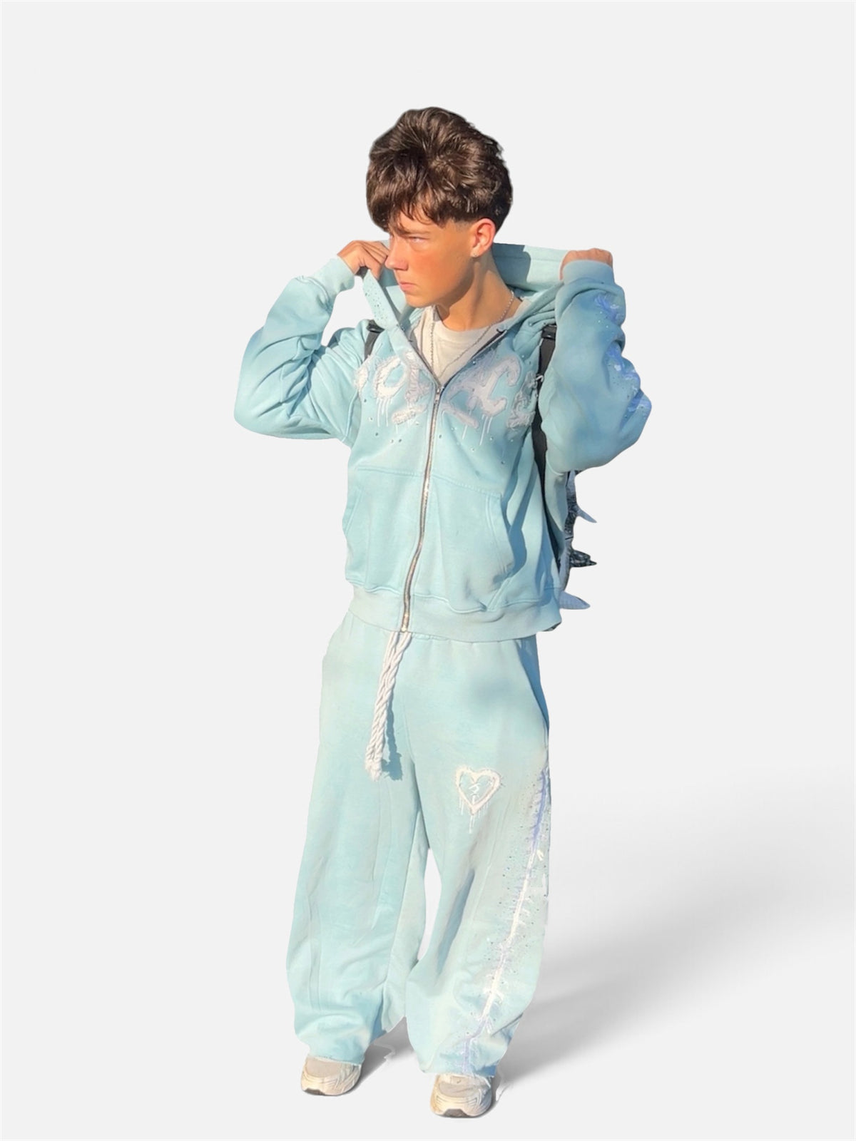 Blue Solace zip-up and sweats set worn by a model